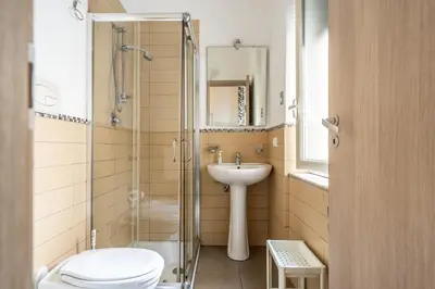 a bathroom with a toilet and a sink and a shower at B&b Glamour in Palermo