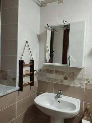 a bathroom with a sink and a mirror at Corleone bed and breakfast in Corleone