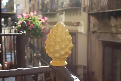 a yellow cone shaped object on a fence at Talitha in Palermo