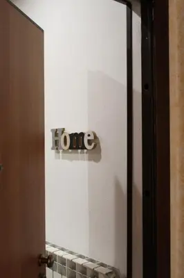 a door with the word home written on it at Talitha in Palermo