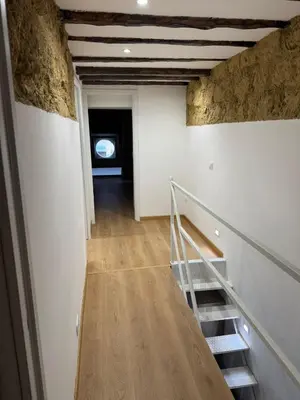 a staircase leading to a room with a window at Sammartino Apartment in Palermo