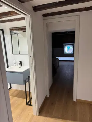 a bathroom with a sink and a mirror at Sammartino Apartment in Palermo
