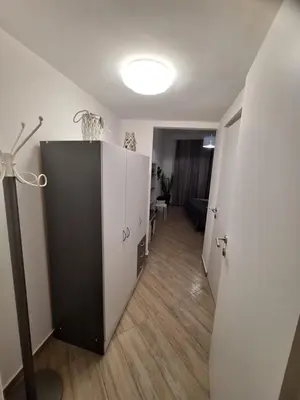 a room with a black and white cabinet and a hallway at Normanni Deluxe Room Palermo in Palermo