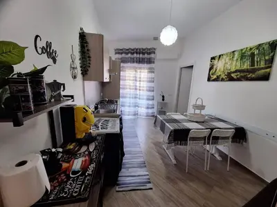 a kitchen and dining room with a table and chairs at Cattedrale Superior Room plus Terrace Palermo in Palermo
