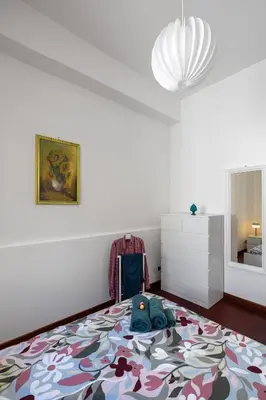 a bedroom with a large rug on the floor at Villa Yasmine in Cinisi