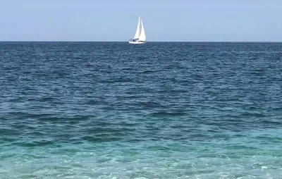 a sail boat in the middle of the ocean at 1 Bedroom Cozy Apartment In Balestrate in Balestrate