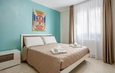 a bedroom with a bed with two towels on it at 1 Bedroom Cozy Apartment In Balestrate in Balestrate