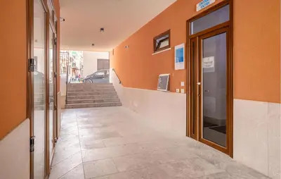 a hallway of a building with a door and stairs at Beautiful Apartment In Balestrate in Balestrate