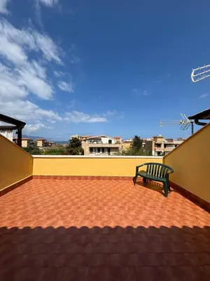 a bench sitting on top of a roof at Aspra Mare House in Ficarazzi