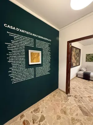 a room with a wall with a painting on it at Casa d'artista Max Serradifalco in Palermo