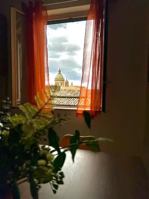 a window with a view of a building at Casa Mortillaro - The Heart of Palermo, Ballaro Market in Palermo