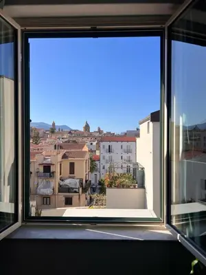 an open window with a view of a city at Casa Mortillaro - The Heart of Palermo, Ballaro Market in Palermo