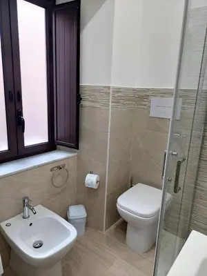 a bathroom with a toilet and a sink and a shower at Sweet dreams AF in Palermo