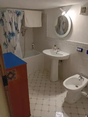 a bathroom with a sink and a toilet at Capo in Palermo