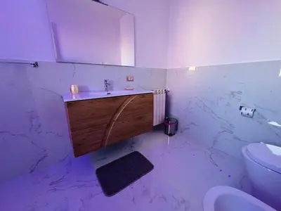 a bathroom with a sink and a toilet at From Flori in Terrasini