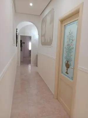 a hallway with a door and a tile floor at Casa Vacanza Marion in Palermo