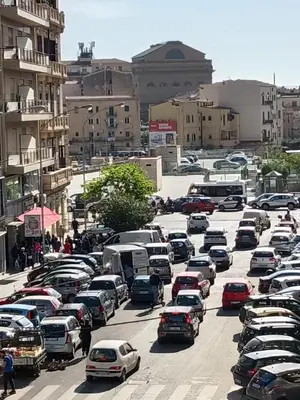 a parking lot full of cars in a city at Casa Vacanza Marion in Palermo