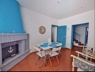 a bedroom with a bed with towels on it at Holiday Home Green Paradise in Palermo