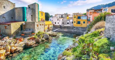 a view of a river in a city with buildings at Nest - Family House in Santa Flavia
