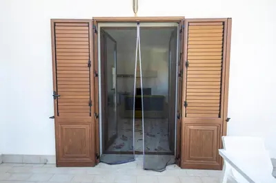 a glass door leading to a shower in a room at Casa Cloe Mondello in Palermo