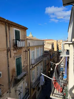 a view of an alley from a balcony of an apartment at Casamori 3- nel cuore del mercato Ballarò in Palermo
