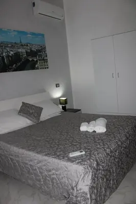 a bedroom with a bed with two towels on it at Agadir Apartment in Palermo