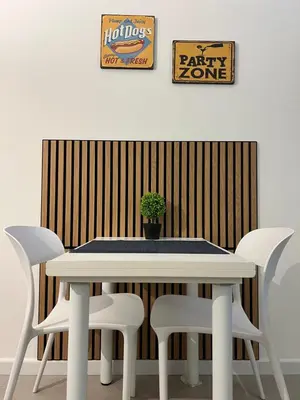 a white table with white chairs and a potted plant at Al Tribunale Guest House in Palermo