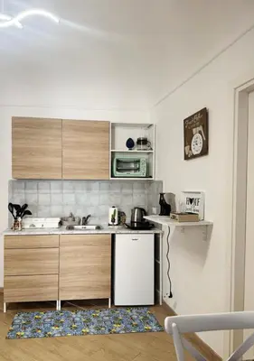 a kitchen with a sink and a microwave at Shama APARTMENTS in Palermo
