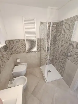 a bathroom with a shower and a toilet and a sink at Central modern vacation home in Lascari - Casa Vacanze Luna in Lascari
