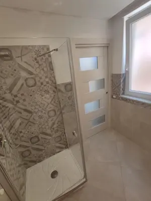 a bathroom with a shower with a glass door at Central modern vacation home in Lascari - Casa Vacanze Luna in Lascari