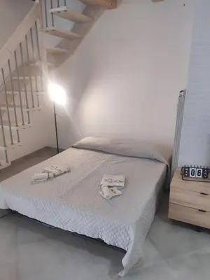 a bedroom with a bed with two towels on it at Central modern vacation home in Lascari - Casa Vacanze Luna in Lascari