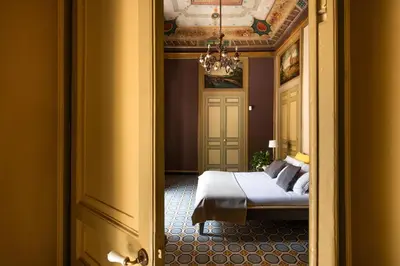 a view of a bedroom with a bed and a ceiling at iFlat Suite del Barone with Terrace in Palermo