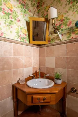 a bathroom with a sink and a mirror at iFlat Suite del Barone with Terrace in Palermo
