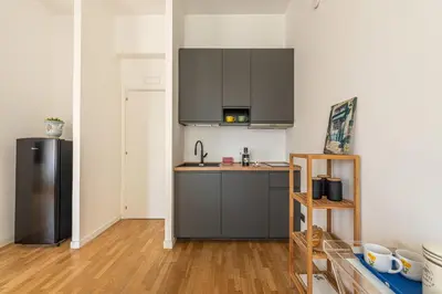 a dining room with a white table and chairs at Vetro Apartments by Wonderful Italy in Palermo