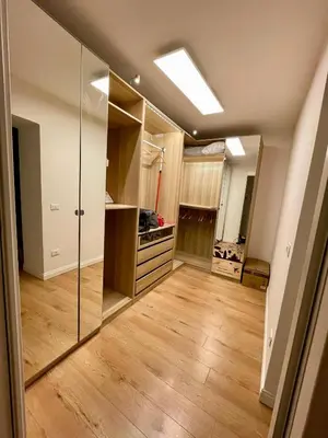 an empty kitchen with a large glass closet at Vicolo Morici in Palermo