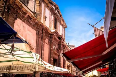 a group of umbrellas in front of a building at Volturno 50 in Palermo