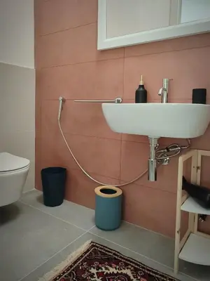 a bathroom with a sink and a toilet at Cà Porto-Rooms with Balcony&Terrace in Santa Flavia
