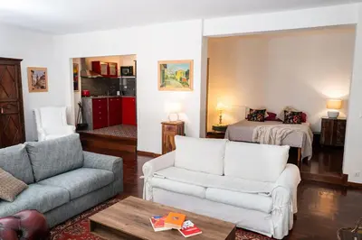 a living room with a couch and a bed at Habitat in Palermo