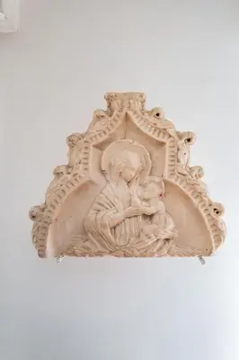 a white statue of a woman and a child at Habitat in Palermo