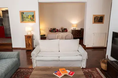 a living room with a couch and a bed at Habitat in Palermo