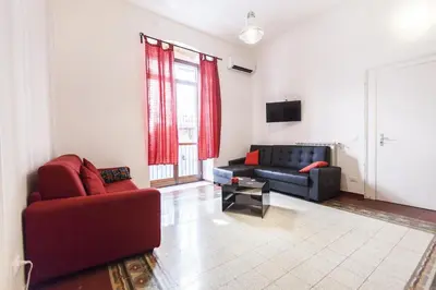 a living room with two chairs and a couch at B&B del Massimo in Palermo
