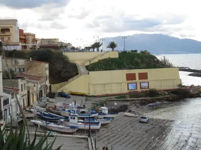 a group of boats parked on a dock next to the water at Casa Vacanze Daisy in Trappeto