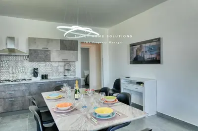 a dining room with a table and chairs in a kitchen at Villa Stella con piscina privata 500 mt dal mare By Sicily Home Solutions in Trappeto
