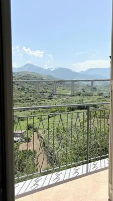 a room with a balcony with a view at Appartamento La Duchessa in Campofelice di Roccella