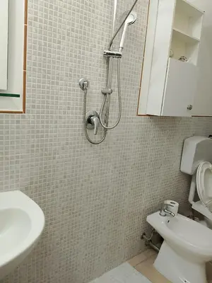 a shower in a bathroom with a toilet and a sink at La Casetta Di Liù in Villagrazia