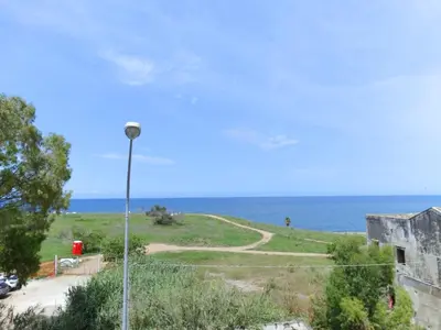 a view of the ocean from a building at La Maschera di Giano, case vacanza vista mare in Palermo