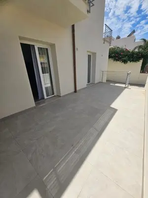 an empty patio of a house with the sun shining on it at Alle Porte di San Vito in San Vito lo Capo