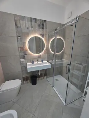 a bathroom with a shower and a sink and a toilet at Alle Porte di San Vito 2 in San Vito lo Capo