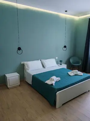 a bedroom with a bed with two towels on it at MARE Suite in Palermo