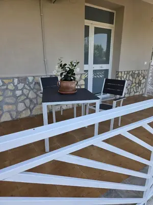a table with a potted plant on top of it at Nonna Franca GuestHouse in Isola delle Femmine